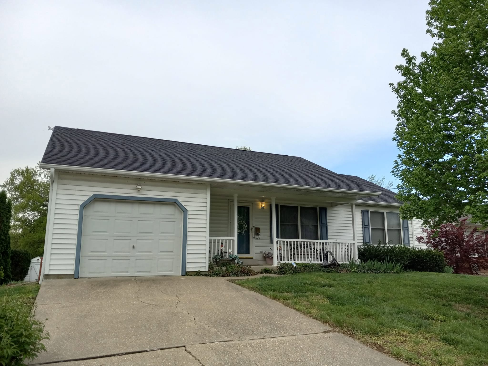 Integrity Roofing completed roof replacement with dark shingles